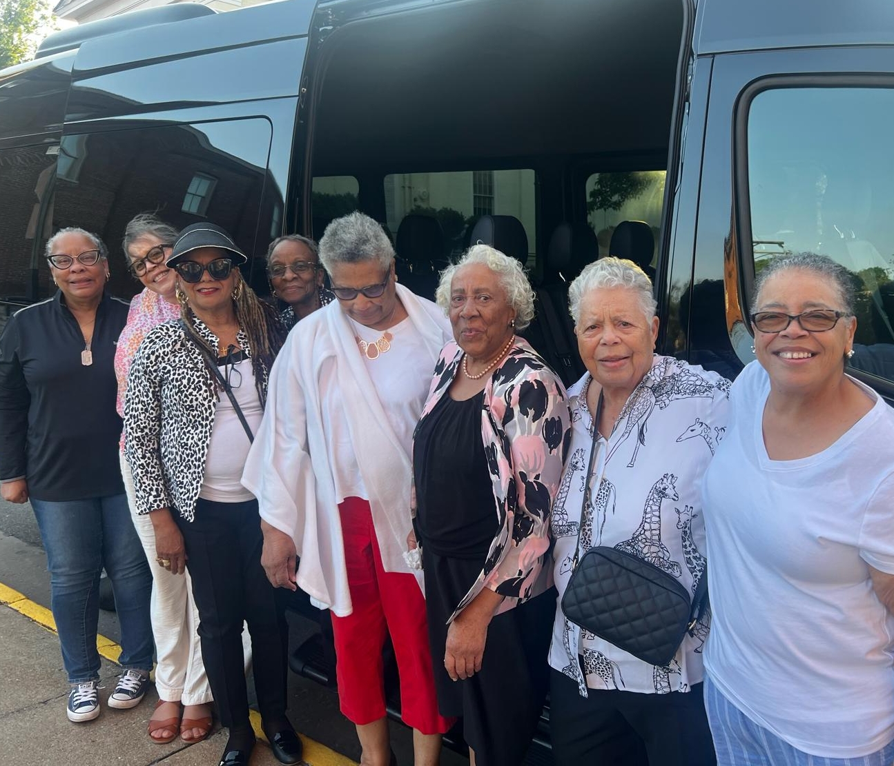 A group of mature people on a church tour with Traveller shuttle Services